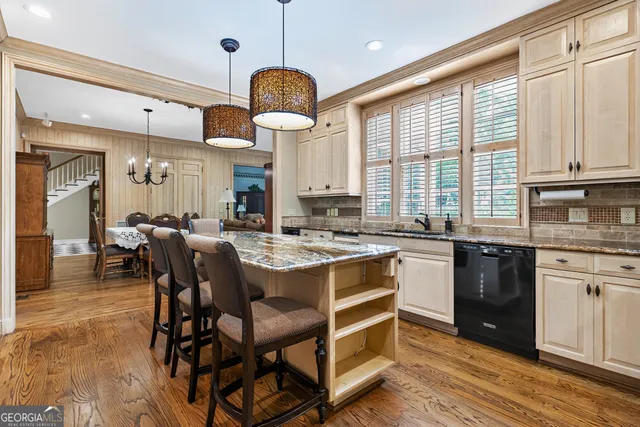 a utility room with cabinets washer and dryer