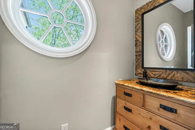 a living room with furniture a fireplace and a table
