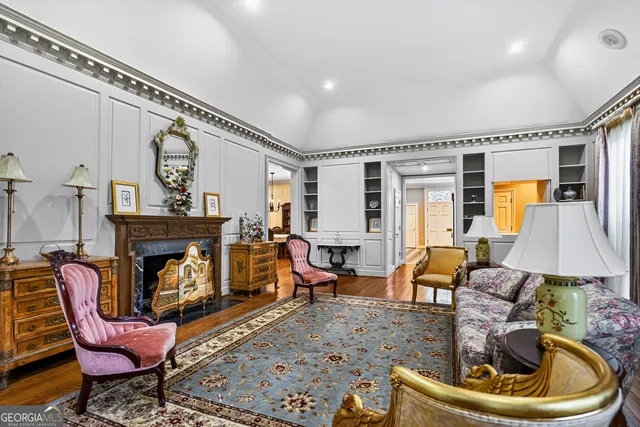 a spacious bathroom with a double vanity sink a mirror and a shower