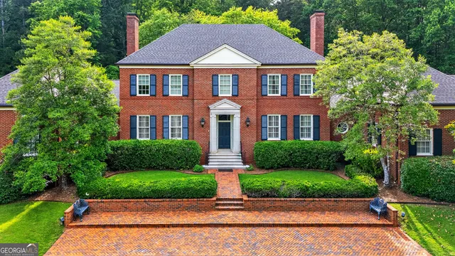 a view of an entryway with wooden floor and stairs