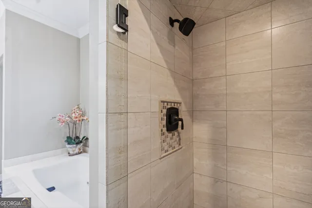 a view of a street with a yard and large trees