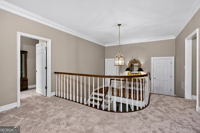 an aerial view of a house with garden space and street view