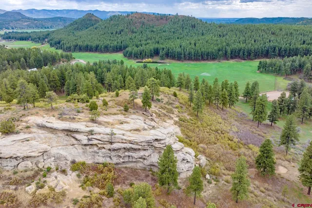 a view of a lake with a yard