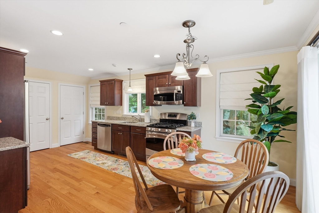 2 B Gates Lane, Unit B Wakefield, MA 01880 - Photo 7 of 42 a kitchen with a table and chairs in it