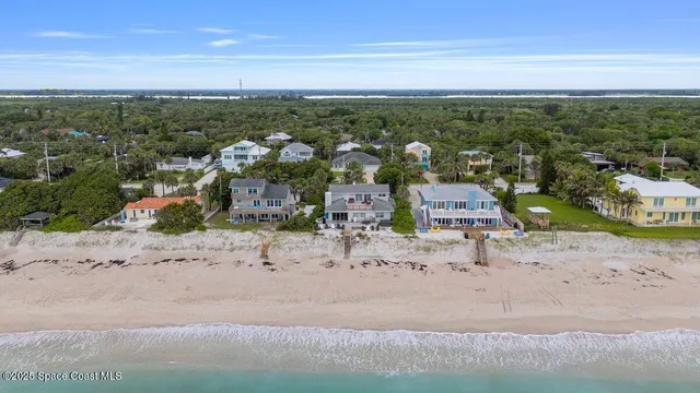 an aerial view of a house with a garden