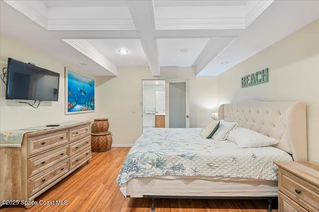 a living room with furniture a chandelier and a fireplace