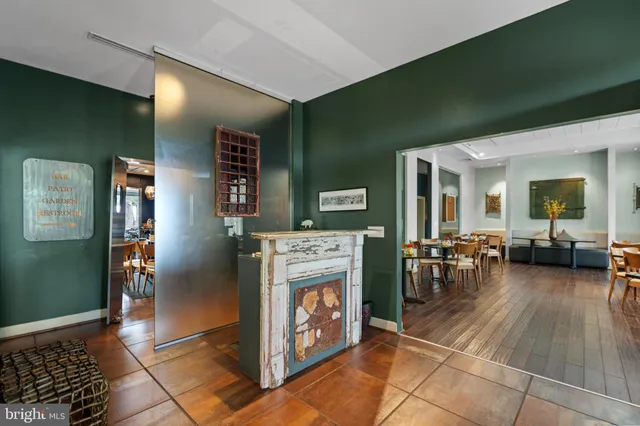 a view of living room with furniture and a fireplace