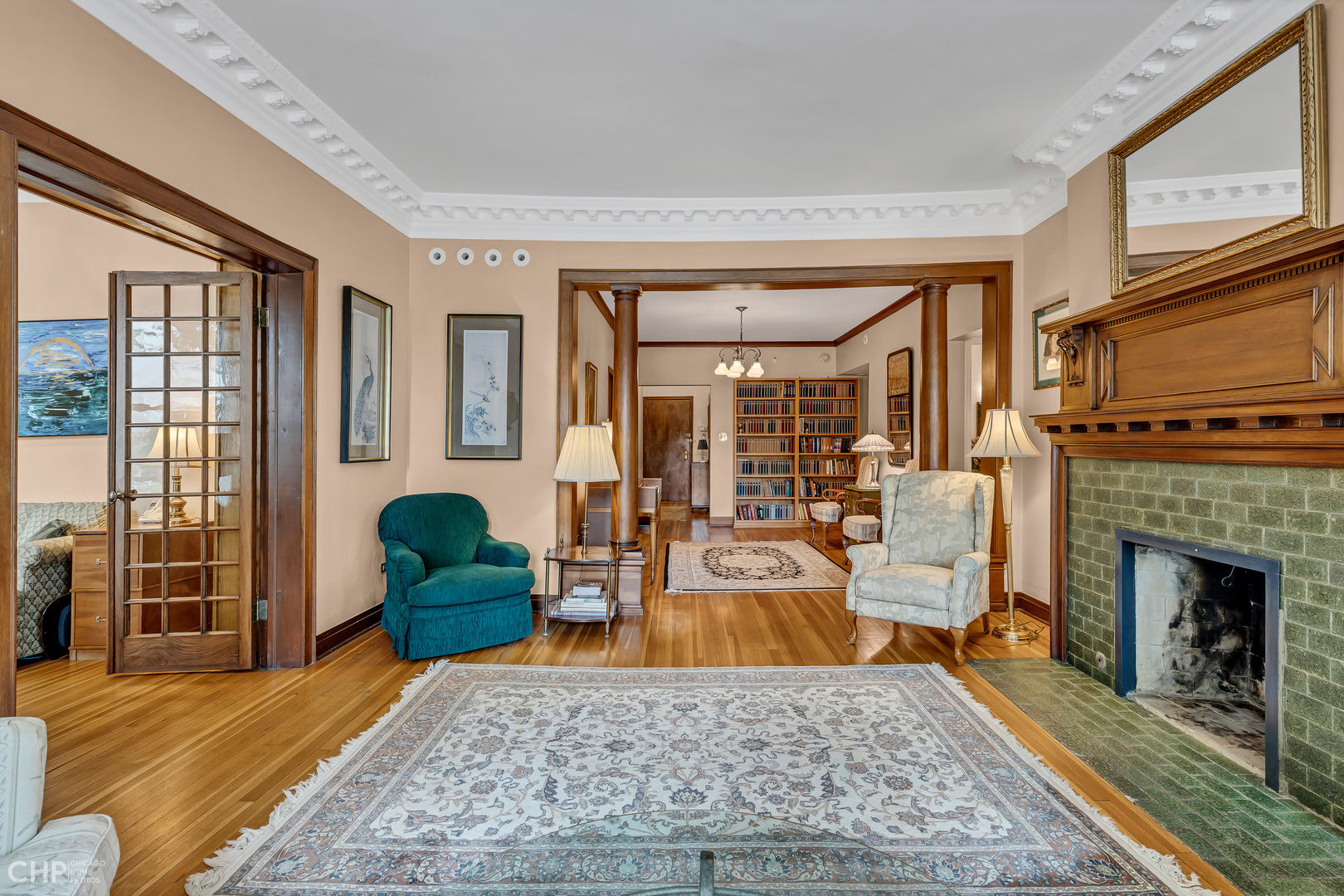 684 West Irving Park Road, Unit E5 Chicago, IL 60613 - Photo 11 of 45 a living room with furniture windows and a fireplace
