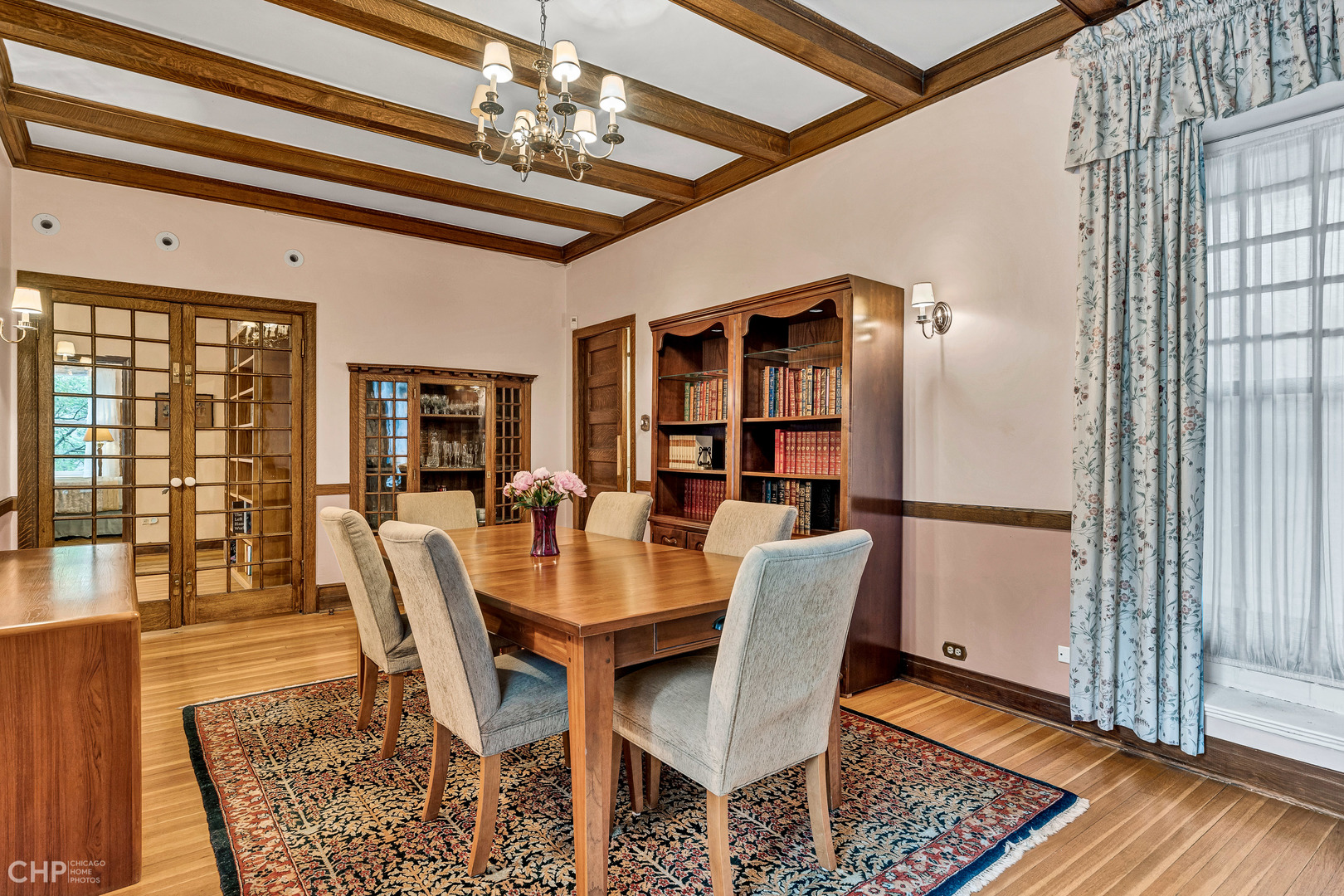 684 West Irving Park Road, Unit E5 Chicago, IL 60613 - Photo 17 of 45 a view of a dining room with furniture window and wooden floor
