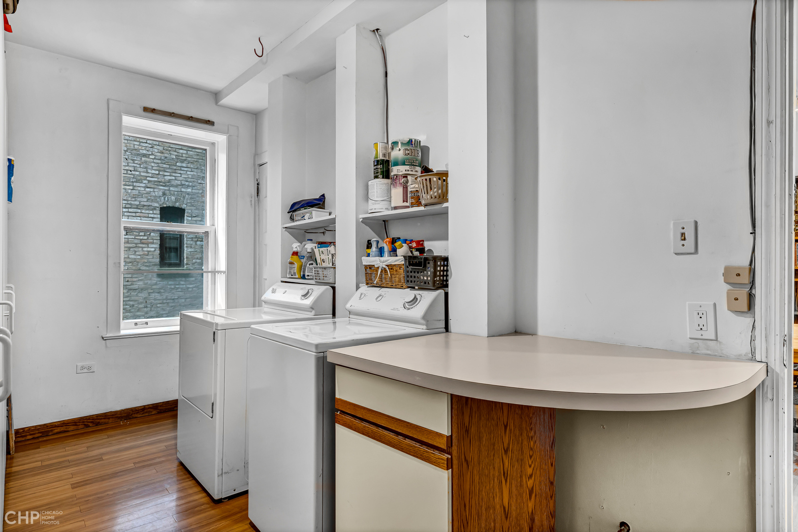 684 West Irving Park Road, Unit E5 Chicago, IL 60613 - Photo 24 of 45 a kitchen with stainless steel appliances a sink and a refrigerator