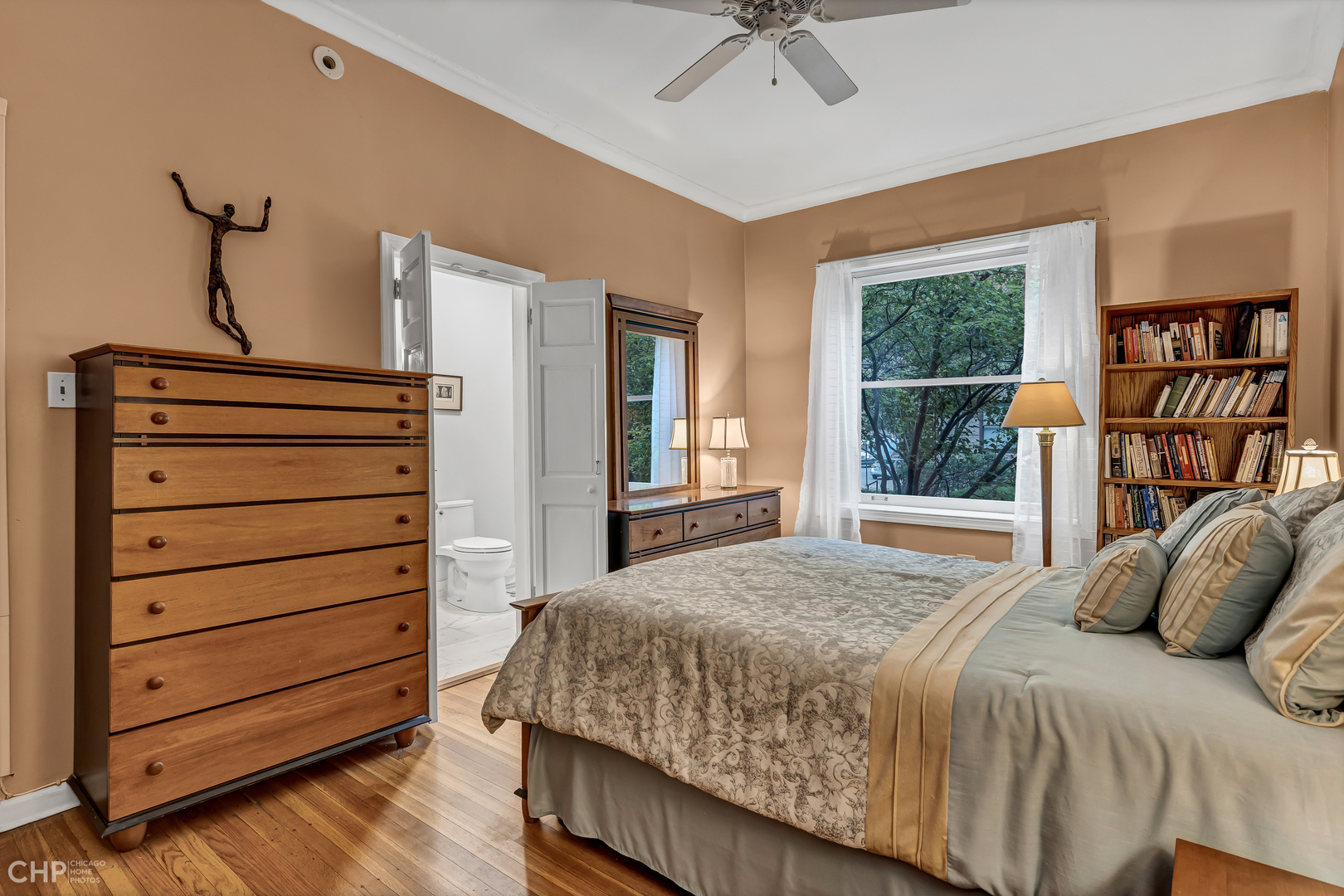 684 West Irving Park Road, Unit E5 Chicago, IL 60613 - Photo 26 of 45 a bedroom with a bed closet and a window