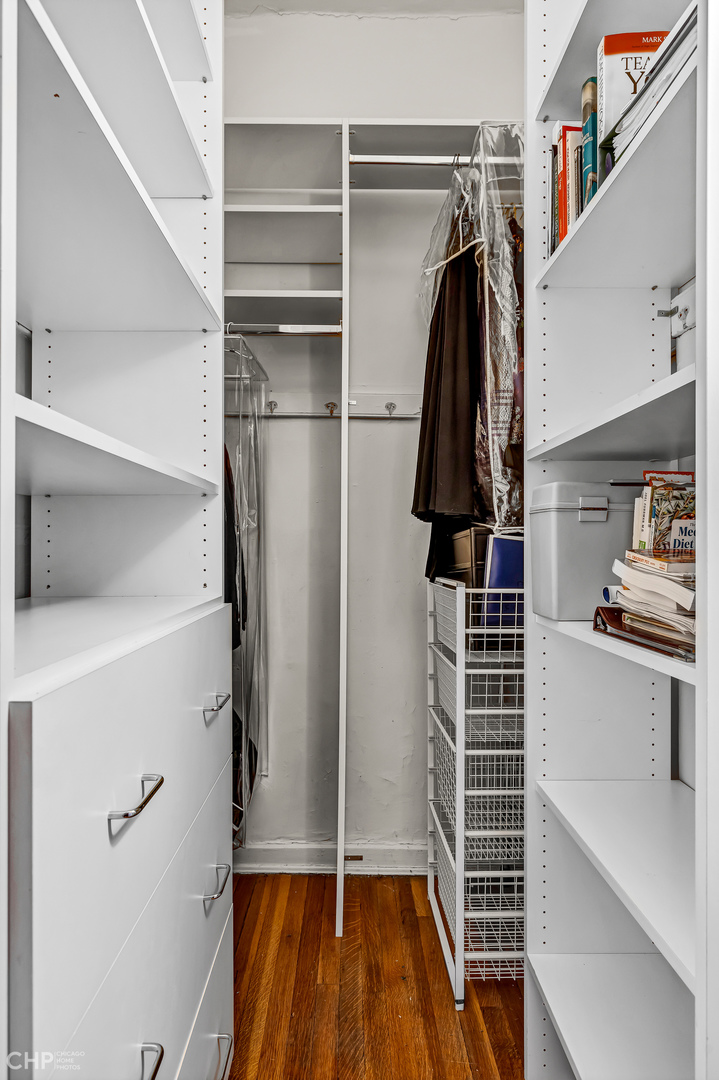 684 West Irving Park Road, Unit E5 Chicago, IL 60613 - Photo 33 of 45 a view of walk in closet with clothes and shoes
