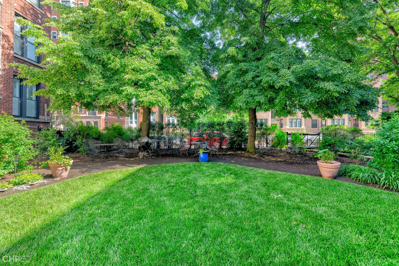 684 West Irving Park Road, Unit E5 Chicago, IL 60613 - Photo 42 of 45 a view of yard with swimming pool and green space