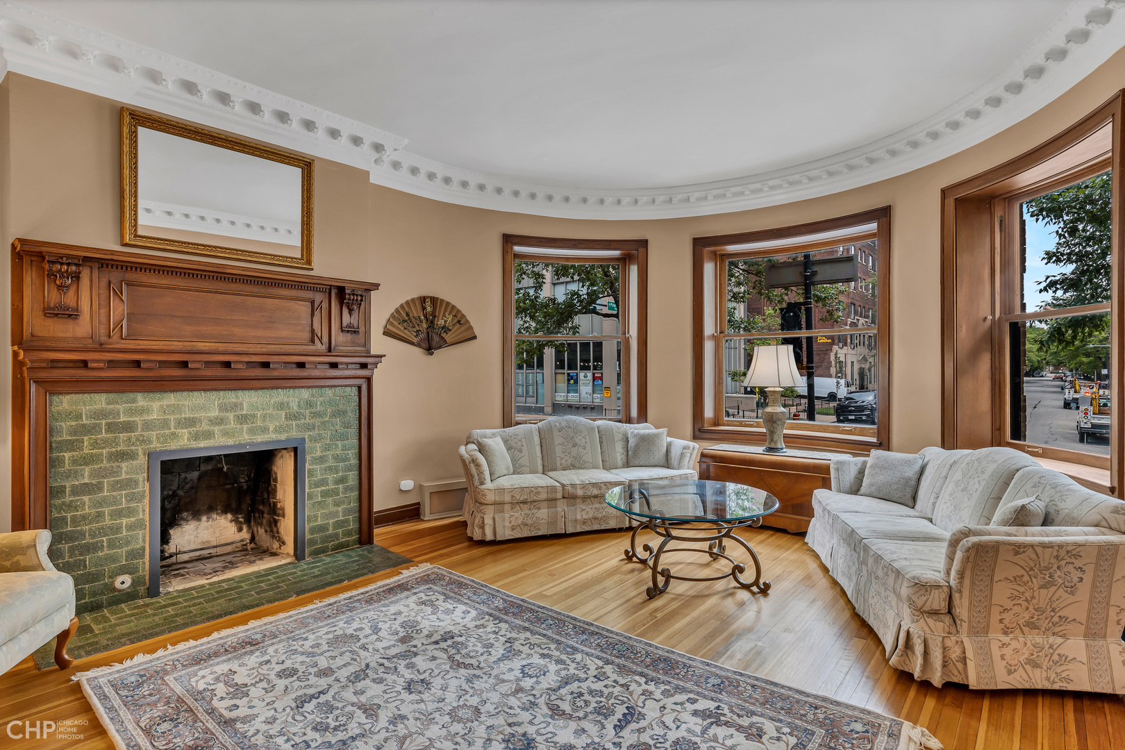 684 West Irving Park Road, Unit E5 Chicago, IL 60613 - Photo 7 of 45 a living room with furniture and a fireplace