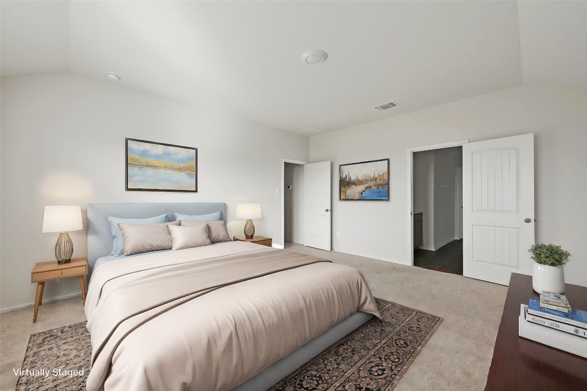 229 Frogmore Loop Kyle, TX 78640 - Photo 15 of 30 a bedroom with a large bed and a couch