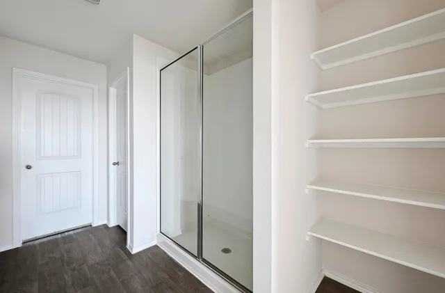 a view of an empty walk in closet