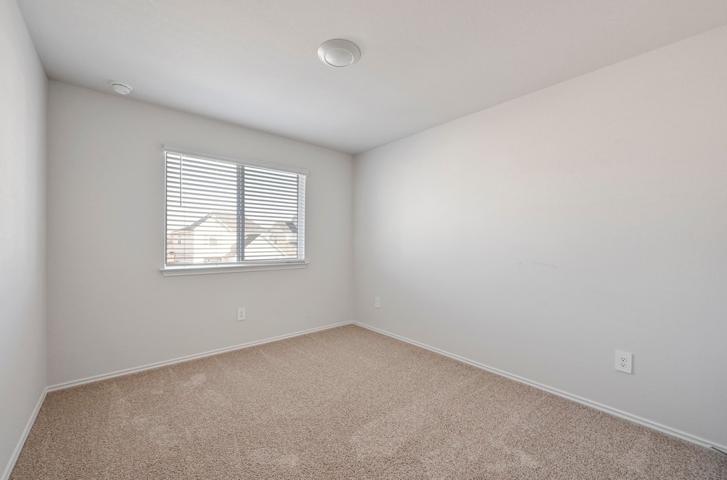 229 Frogmore Loop Kyle, TX 78640 - Photo 22 of 30 an empty room with a window
