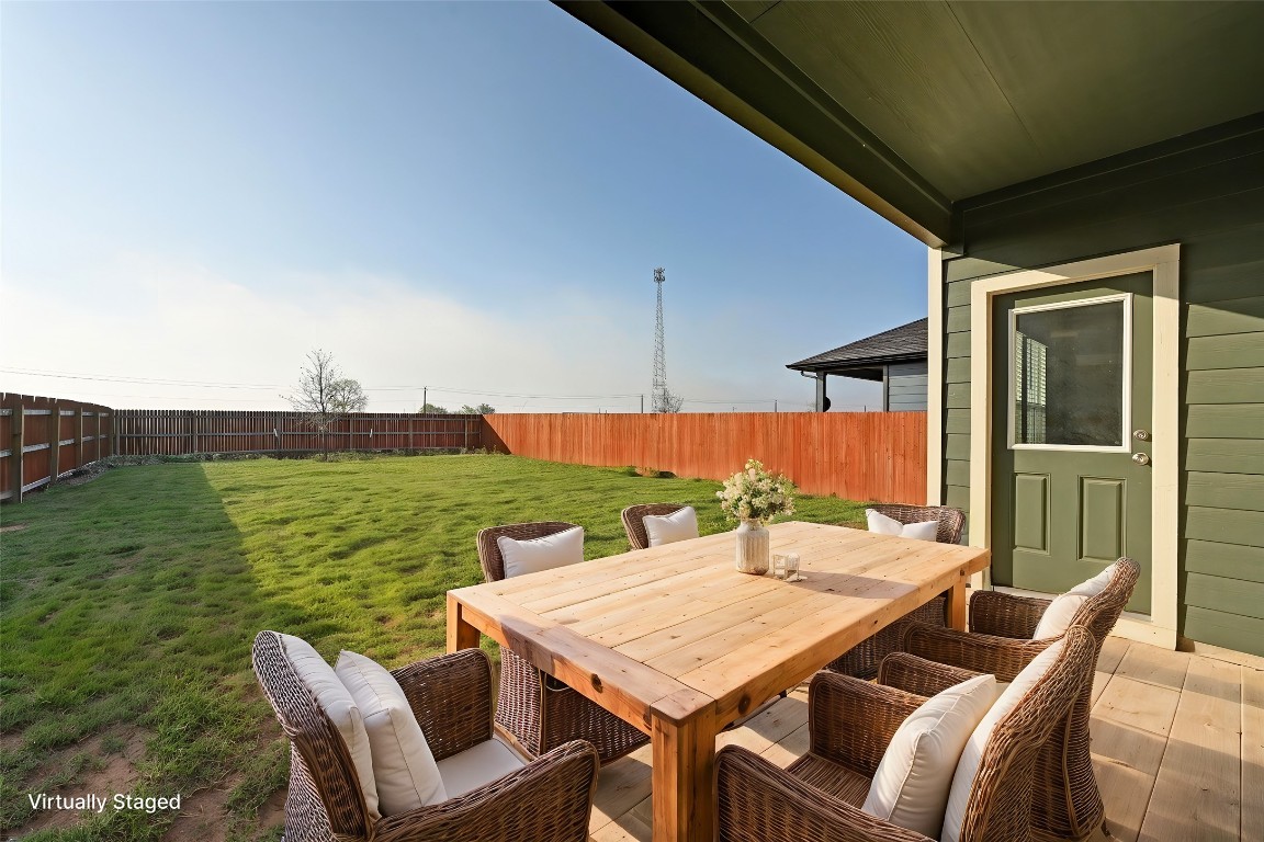 229 Frogmore Loop Kyle, TX 78640 - Photo 25 of 30 a view of an outside dining space with furniture