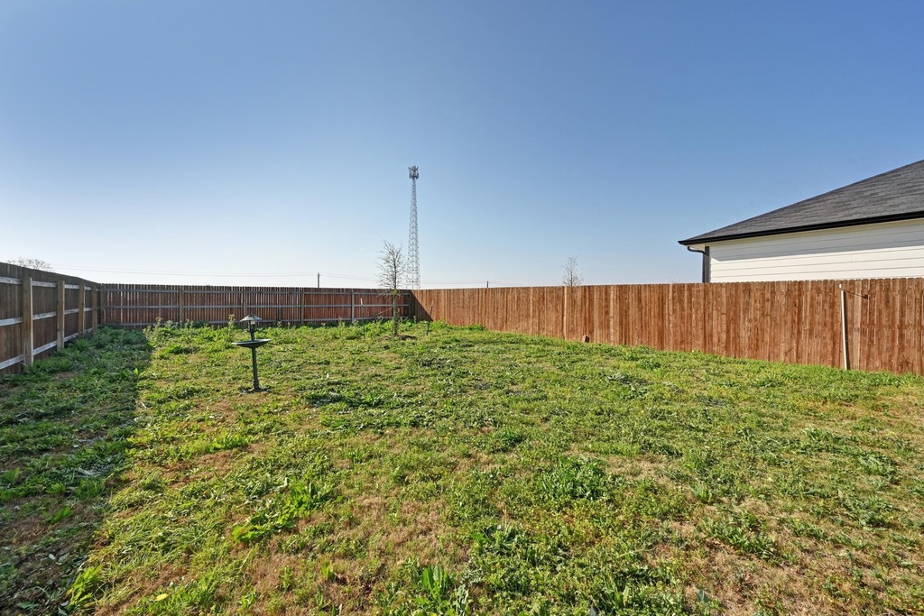 229 Frogmore Loop Kyle, TX 78640 - Photo 27 of 30 a view of a back yard