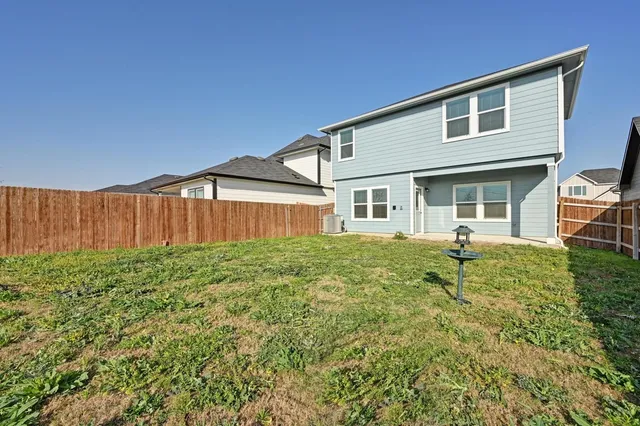 a house view with a backyard space