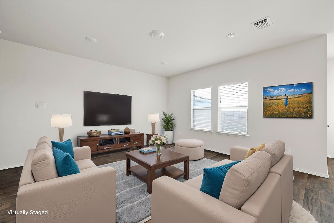 229 Frogmore Loop Kyle, TX 78640 - Photo 6 of 30 a living room with furniture and a flat screen tv