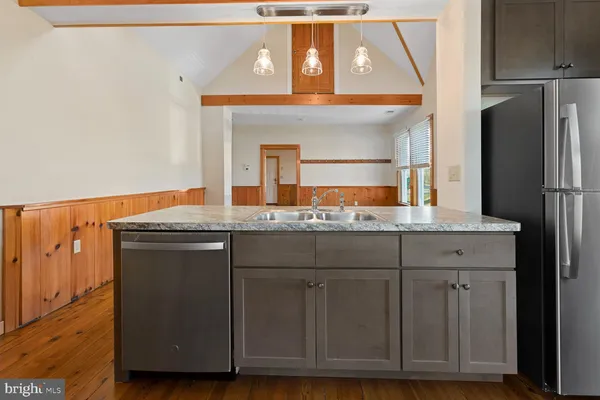 a bathroom with a sink and a large mirror