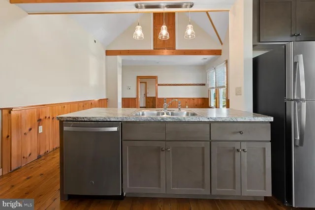 a bathroom with a sink and a large mirror