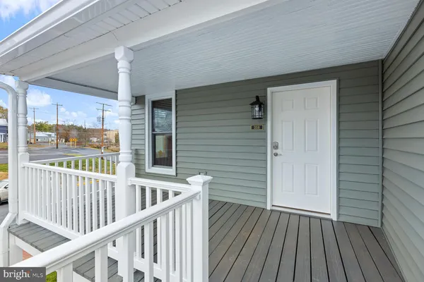 a view of a balcony with wooden floor