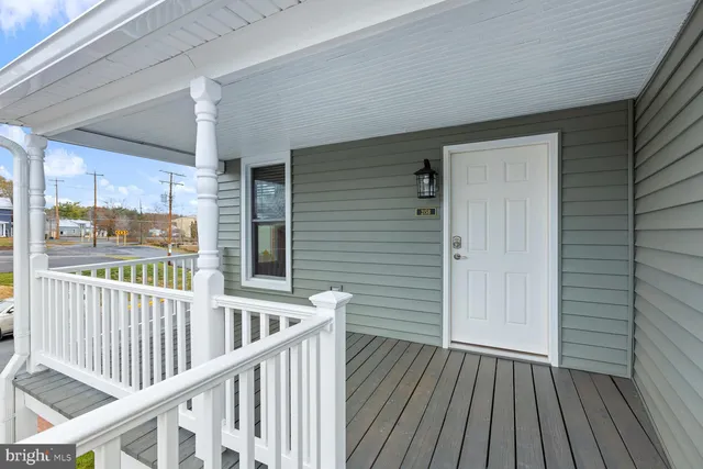 a view of a balcony with wooden floor