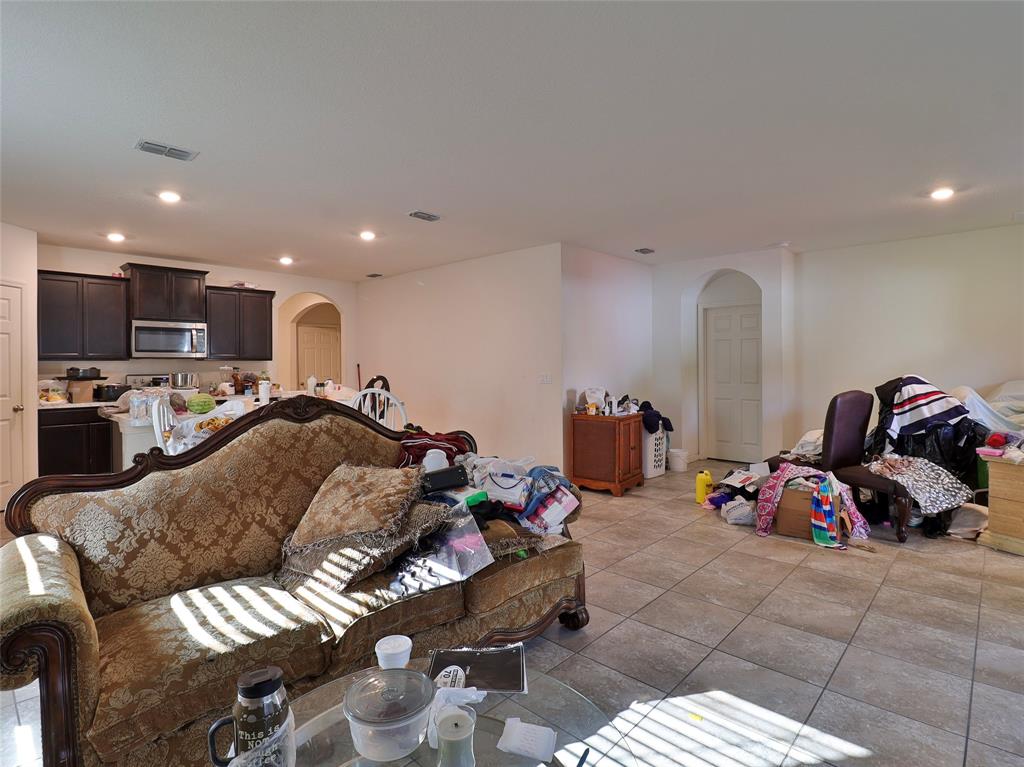 1997 Southwest Cycle Street Port St. Lucie, FL 34953 - Photo 14 of 30 a living room with furniture gym equipment and a view of living room