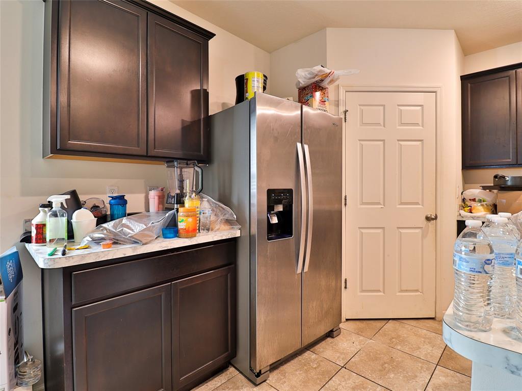 1997 Southwest Cycle Street Port St. Lucie, FL 34953 - Photo 18 of 30 a kitchen with stainless steel appliances a refrigerator and a sink
