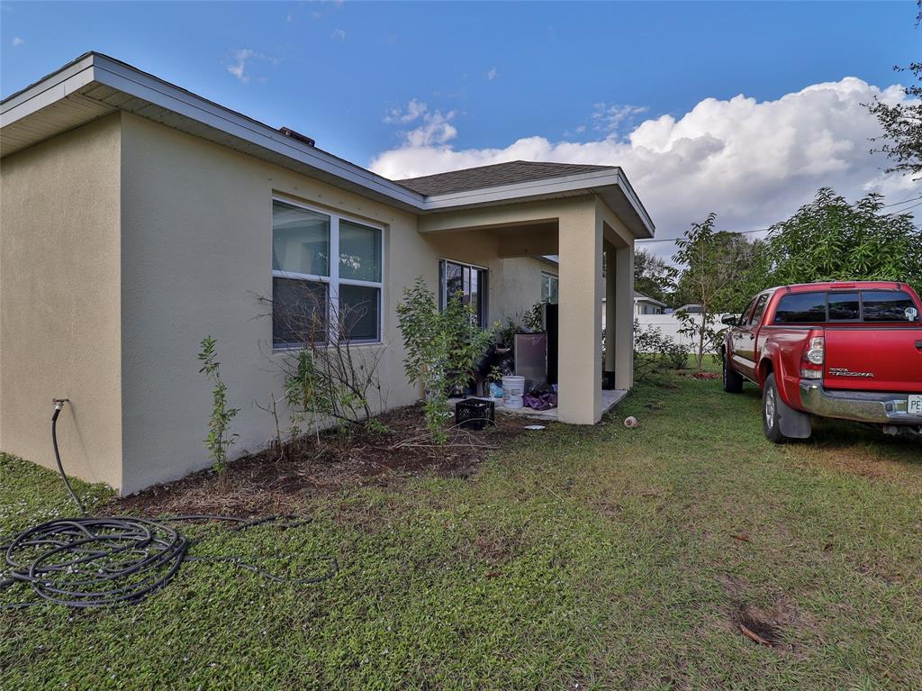 1997 Southwest Cycle Street Port St. Lucie, FL 34953 - Photo 2 of 30 a view of a house with a backyard