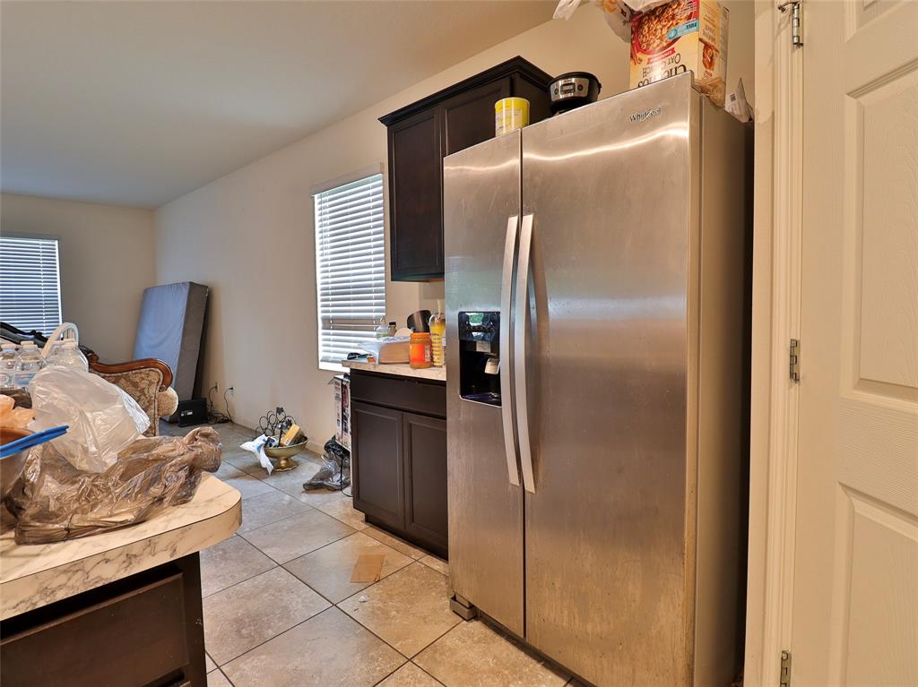 1997 Southwest Cycle Street Port St. Lucie, FL 34953 - Photo 22 of 30 a kitchen with stainless steel appliances granite countertop a refrigerator and a stove