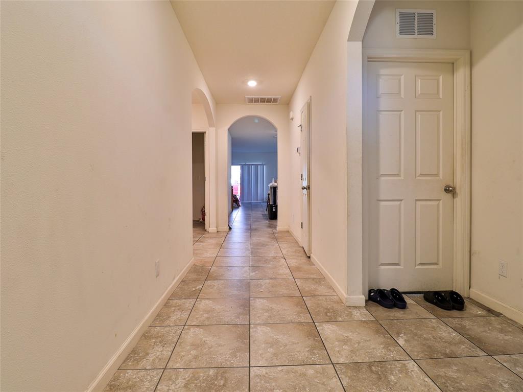 1997 Southwest Cycle Street Port St. Lucie, FL 34953 - Photo 30 of 30 a view of a hallway with a beautiful room and chandelier fan