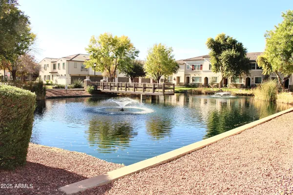 a view of a water fountain and a big yard