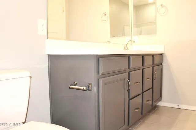 a bathroom with a shower and a mirror