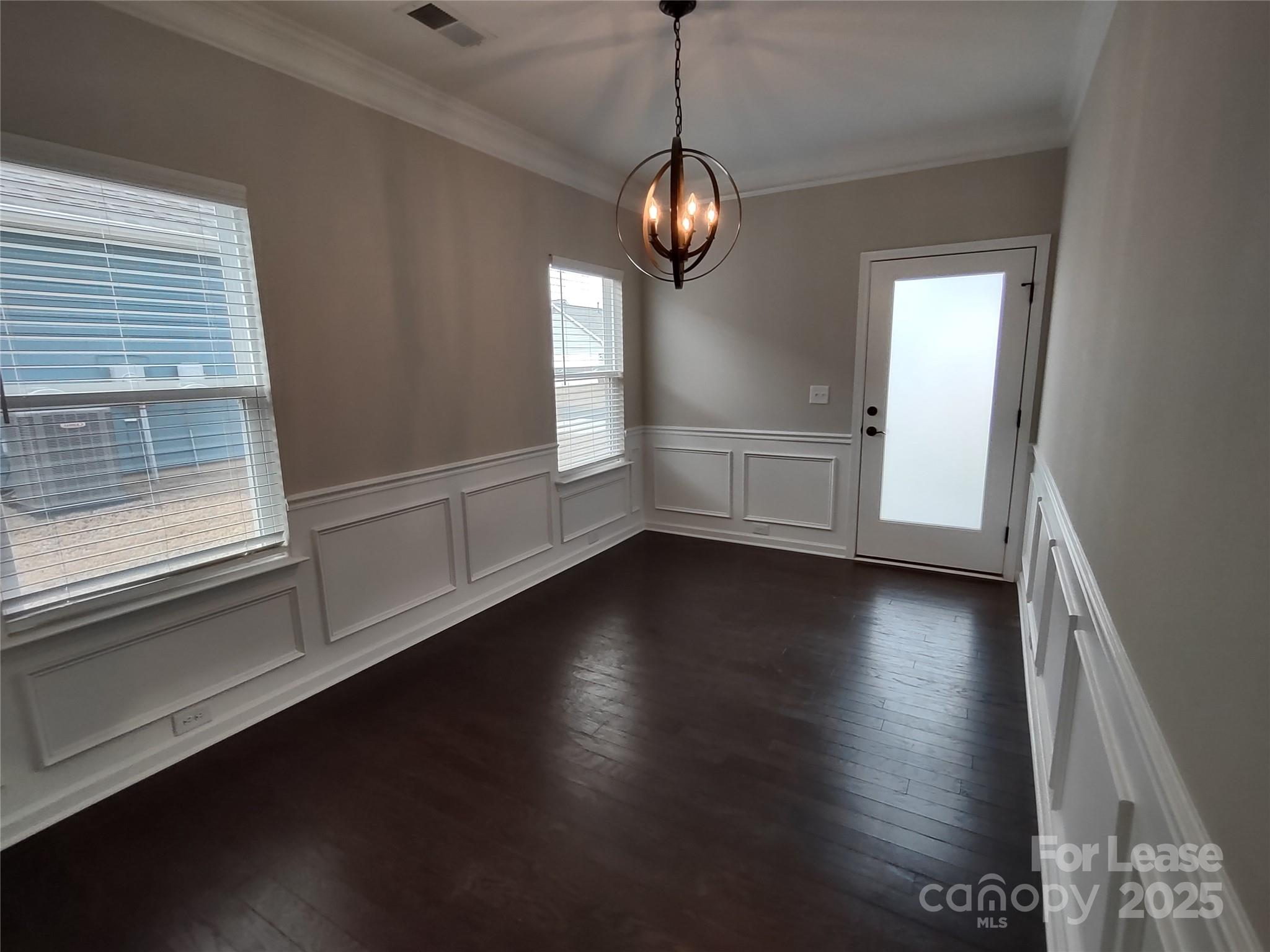 143 Kingston Drive Locust, NC 28097 - Photo 12 of 16 a view of a livingroom with wooden floor and a window