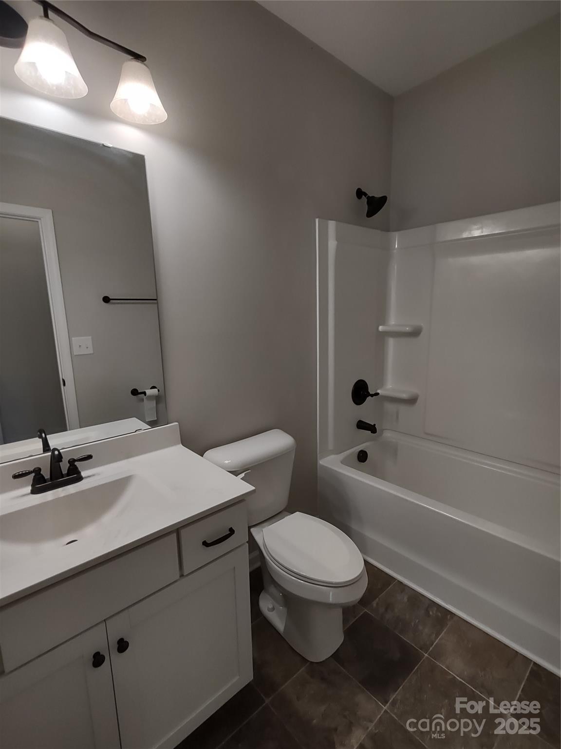 143 Kingston Drive Locust, NC 28097 - Photo 15 of 16 a bathroom with a sink a toilet and shower