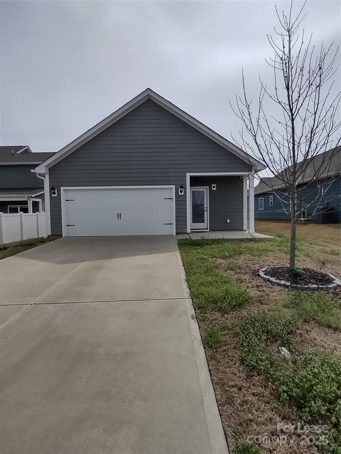 143 Kingston Drive Locust, NC 28097 - Photo 2 of 16 a house view with a backyard space