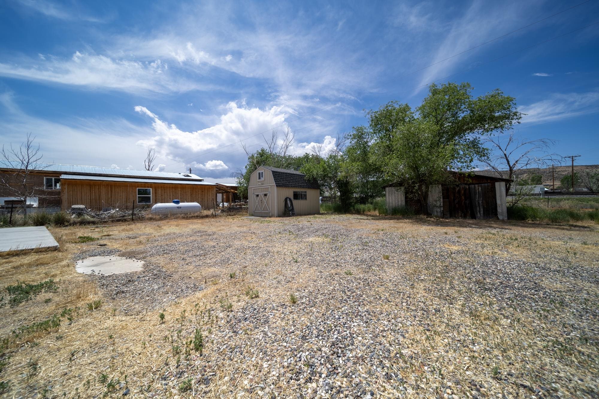 1047 Old Highway Mack, CO 81525 - Photo 11 of 16 a view of a house with a yard