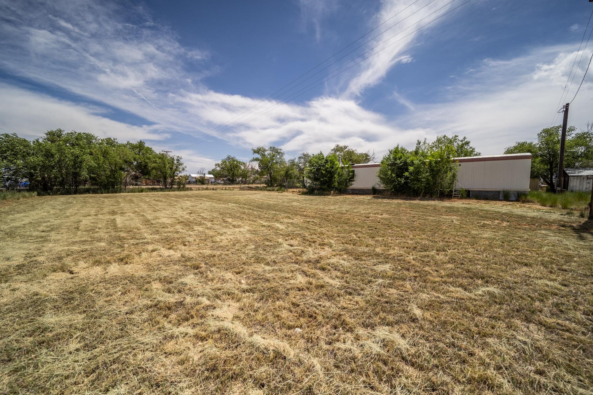 1047 Old Highway Mack, CO 81525 - Photo 14 of 16 a view of backyard with wooden fence