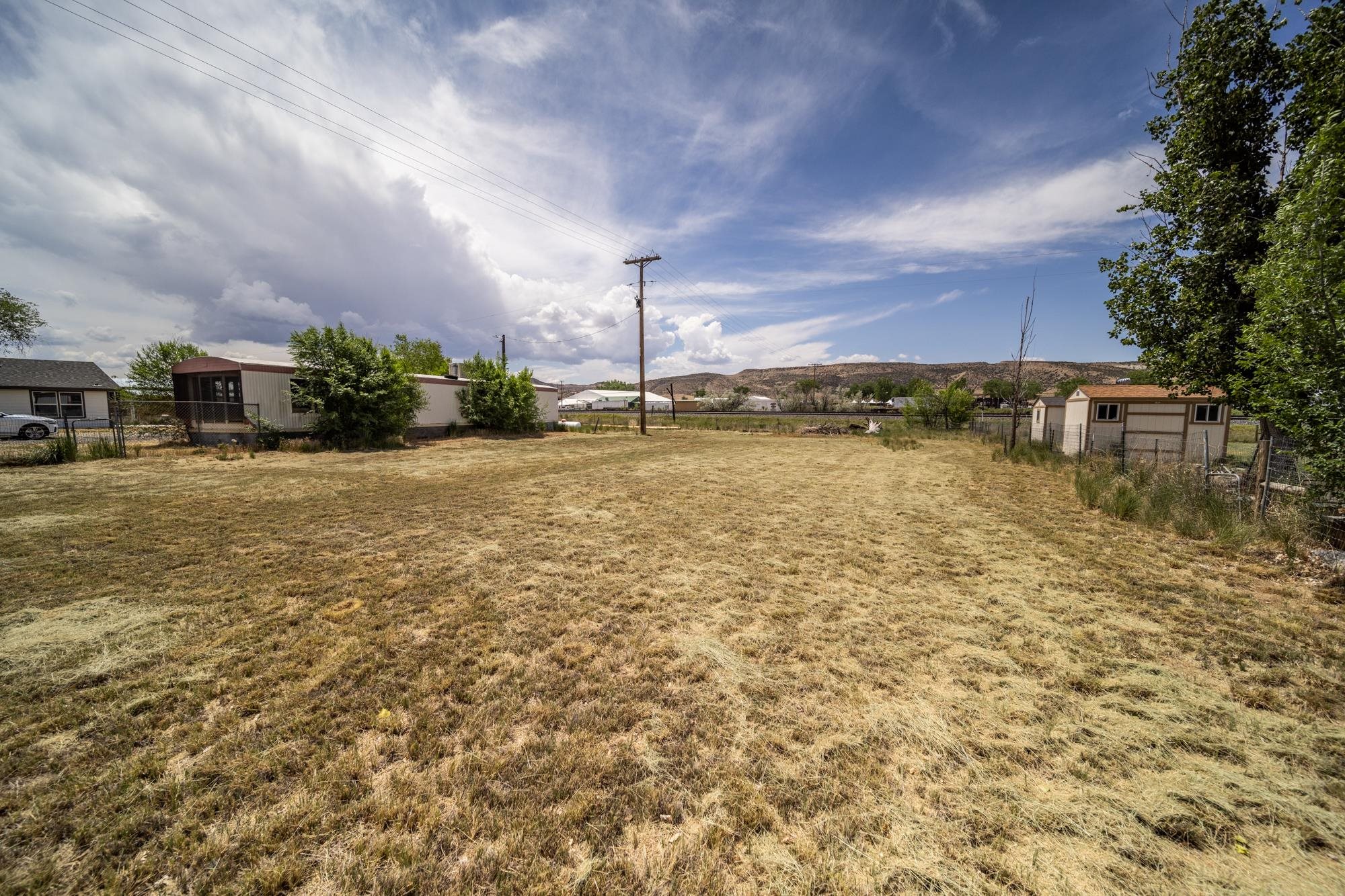 1047 Old Highway Mack, CO 81525 - Photo 15 of 16 a view of a lake with houses in the back