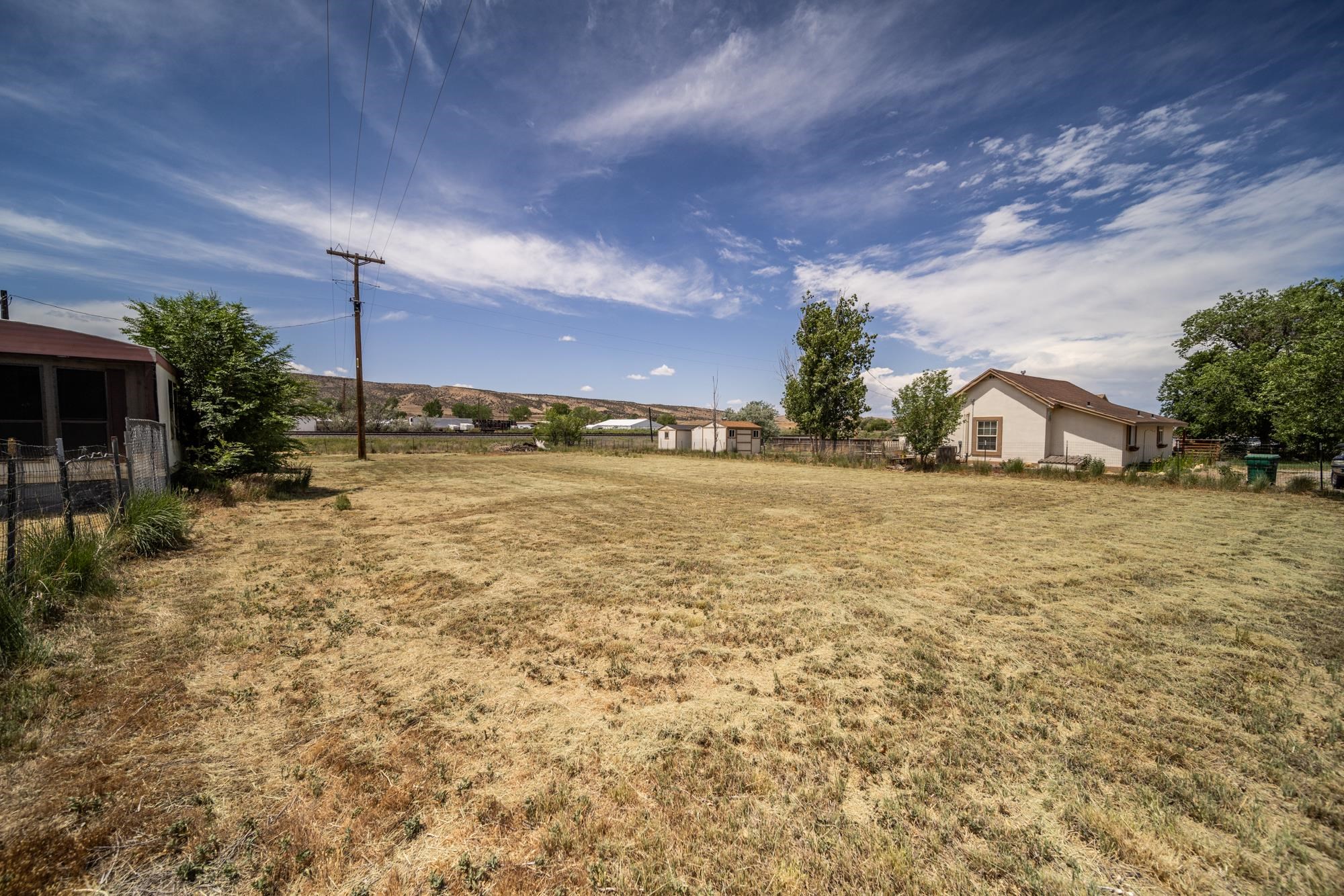1047 Old Highway Mack, CO 81525 - Photo 16 of 16 a bathroom with a sink and shower