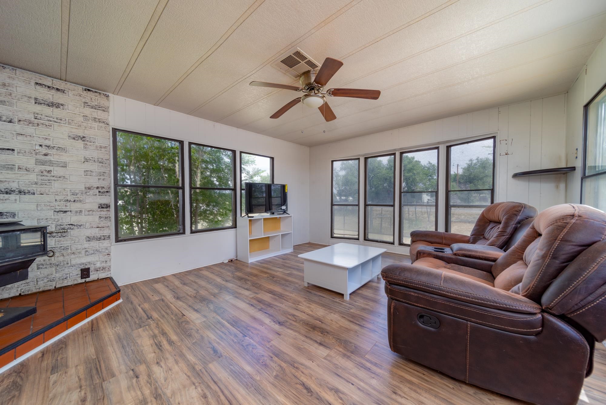 1047 Old Highway Mack, CO 81525 - Photo 3 of 16 a living room with furniture large windows and wooden floor