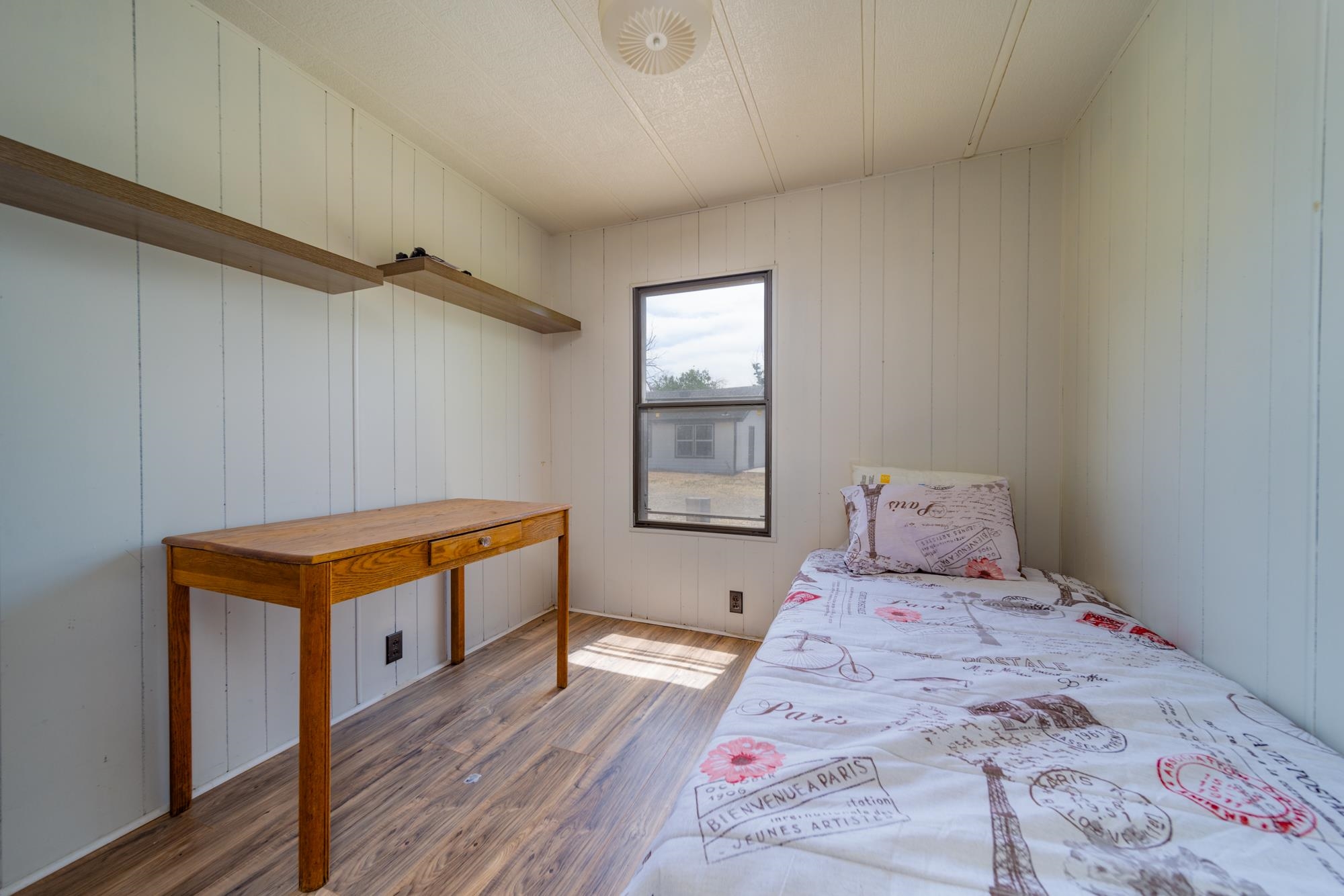 1047 Old Highway Mack, CO 81525 - Photo 6 of 16 a room with bed and wooden floor