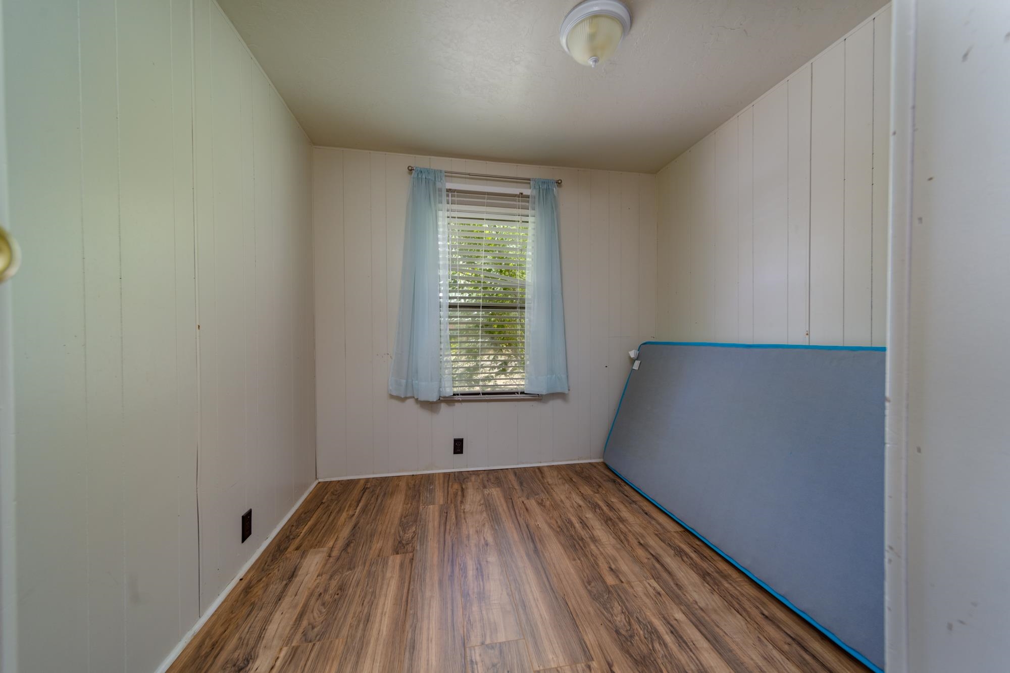 1047 Old Highway Mack, CO 81525 - Photo 7 of 16 a view of room with window and hardwood floor