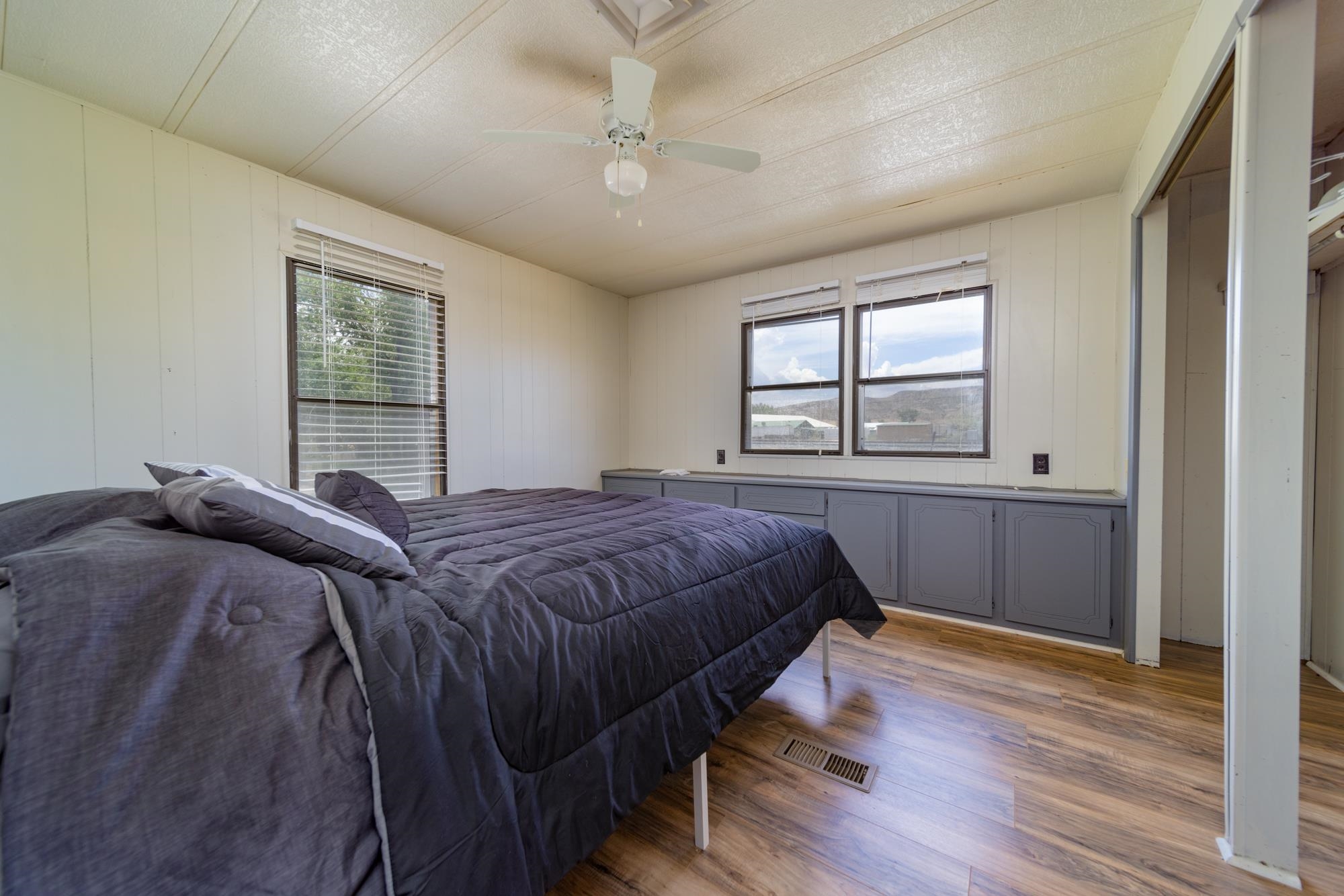 1047 Old Highway Mack, CO 81525 - Photo 8 of 16 a bedroom with a bed and a window