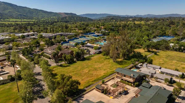 a view of a city with mountains in the background