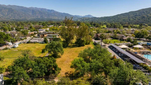 a view of a city with mountains in the background