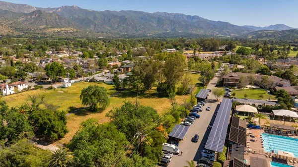an aerial view of residential houses with outdoor space